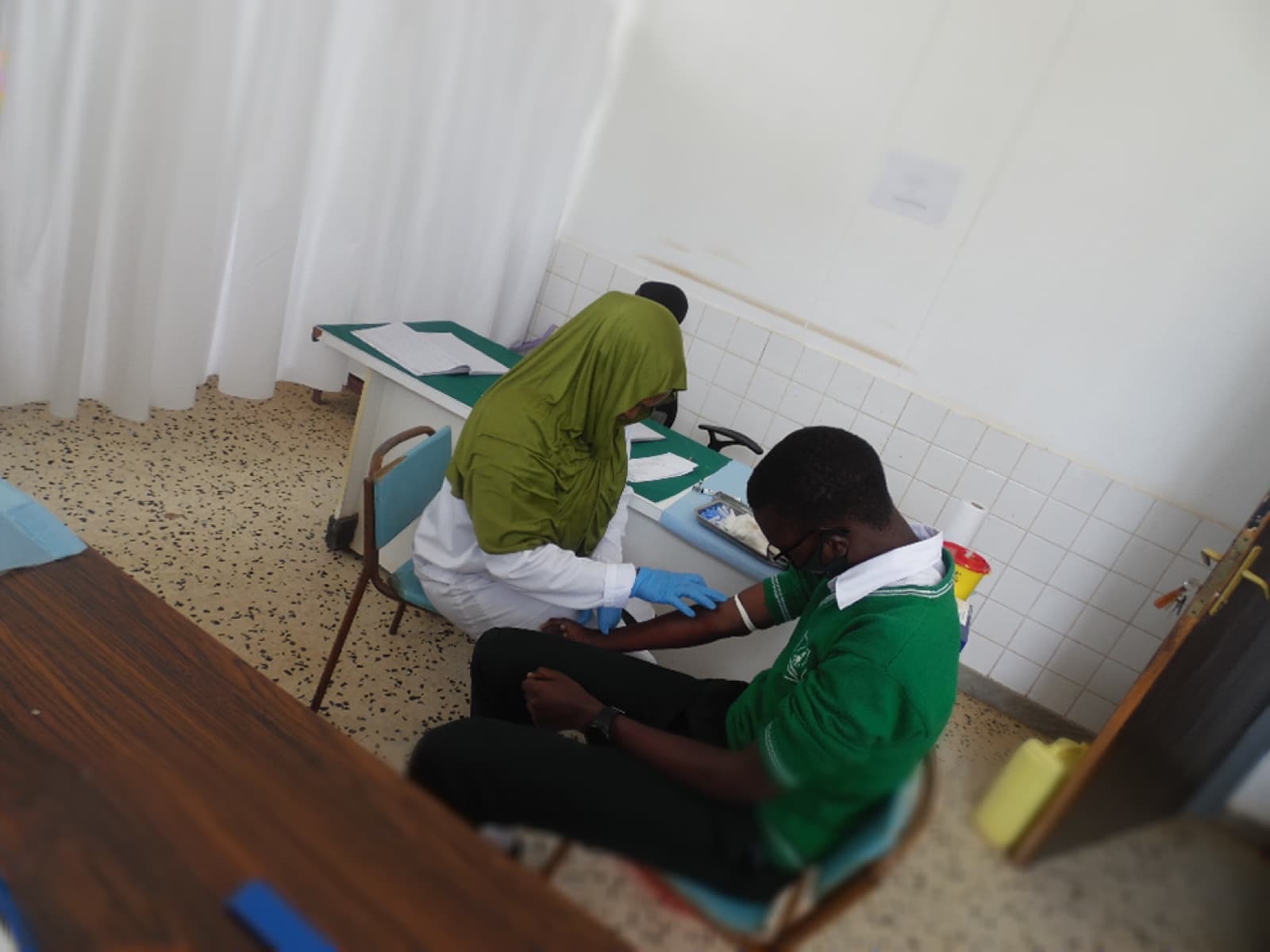 A student receiving care at the ESSI Nyamirambo dispensary