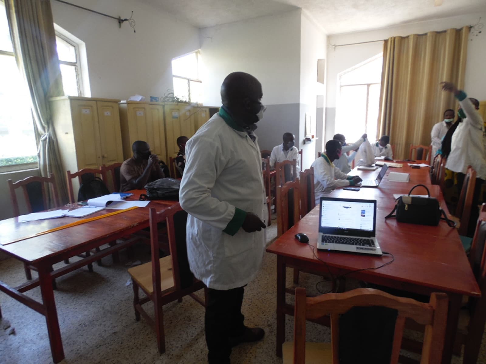 Staff in a school laboratory space at ESSI Nyamirambo